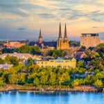 Charlottetown, Prince Edward Island, featuring historic buildings, tree-lined streets, and a scenic waterfront.