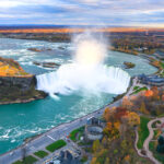 An aerial view of Horseshoe Falls in Canada, showcasing the powerful waterfall and mist.