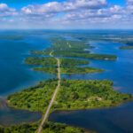 Parks along the St. Lawrence River, featuring lush greenery, scenic paths, and the river flowing in the background.