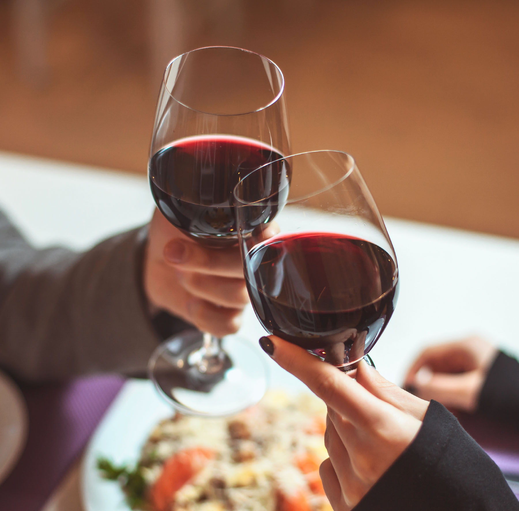 Glasses of wine celebrating on the table