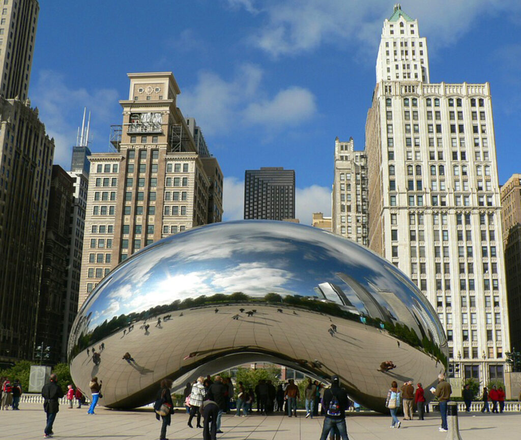 A picture of 'The Bean' in Chicago, a large, reflective, bean-shaped sculpture in Millennium Park.