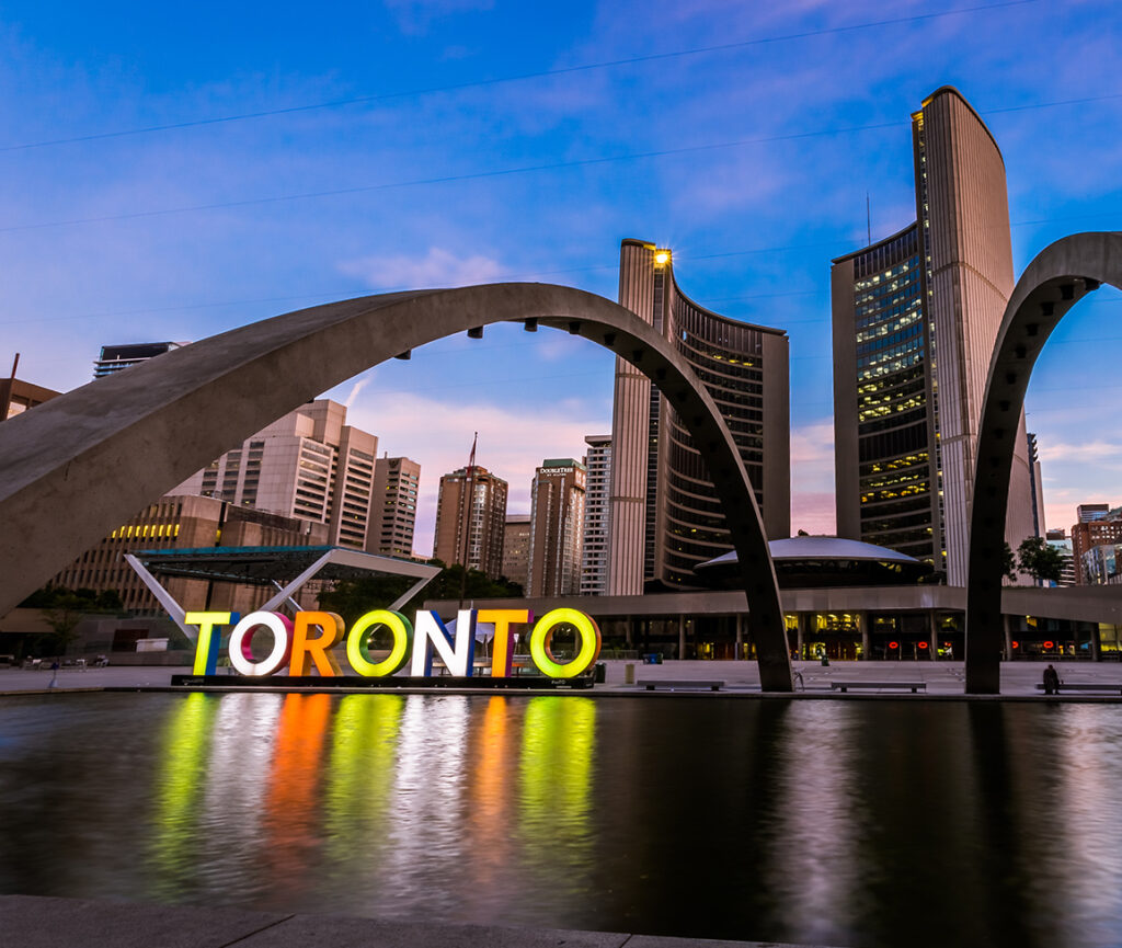 A picture of Nathan Phillips Square in Toronto, showcasing the iconic Toronto sign and modernist architecture.